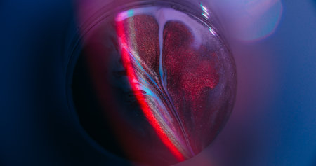 Round ink. Abstract neon. Defocused purple red yellow color shiny rainbow bright texture spilling on...