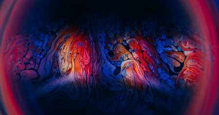 Liquid flare texture. Defocused ink blend. Colorful dye light spilling in emulsion. Red blue orange...