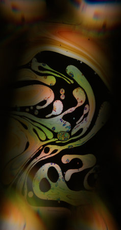 Blur leak paint. Gasoline texture. Orange green ink color emulsion mix on dark water. Dye floating...