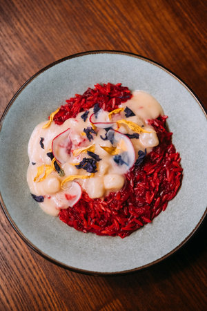 Paella served. Scallops dish. Traditional spanish cuisine bright recipe with sauce. Tasty meal for delicious dinner in restaurant.の写真素材