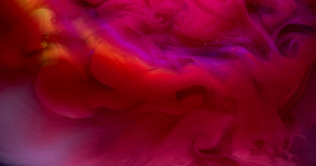 Ink explosion. Bright smoke. Pink red color fume swirl spread in water. Arch ray abstract haze...
