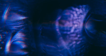 Blur abstract flare. Beam glow. Purple blue color radiant glisten on visual optical reflection luminous light art illuminated background.の写真素材