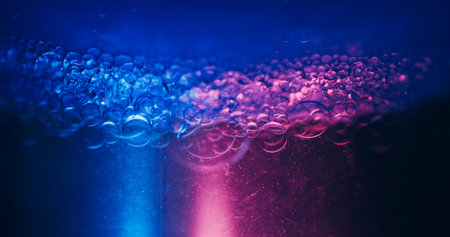 Neon bubbles. Soapy balls. Defocused blue purple color gradient round water bright texture on...