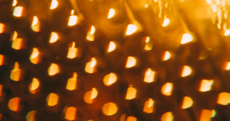 Blur illuminated gleam. Shiny texture. Hot orange color round optical vibrant lens flare on abstract...