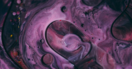 Bubbles stream. Oil drop. Defocused purple vibrant color glitter fluid round ink water emulsion floating on abstract art background.の写真素材