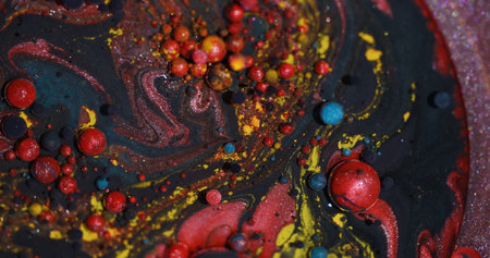 Colorful bubbles. Bokeh oil. Blur purple yellow red glitter round texture sparkling fluid paint on...