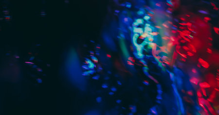 Blur glare. Gradient reflection. Fluorescent abstract colorful glow mix on dark background. Red blue holographic neon gleam optic effect.の写真素材