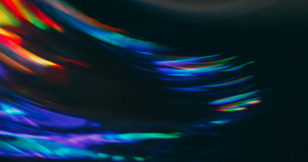 Blur ray rotate. Spectrum glow. Colorful bright neon curve beam whirl spin with abstract red purple green twinkle on black background.の写真素材