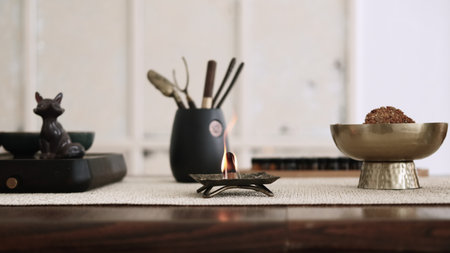 Incense burning. Spiritual practice. Tools for meditation yoga activity mental health smoke fire destress oriental atmosphere.の写真素材