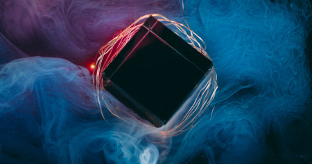 Haze color wave. Art glass cube. Purple blue paint defocused cloud flow on garland light. Abstract steam blend on black background.の写真素材