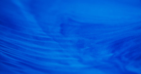 Blur wave background. Color art texture. Blue striped fluid dissolving spill. Liquid ink ripple effect bright pigment abstract flow.の写真素材