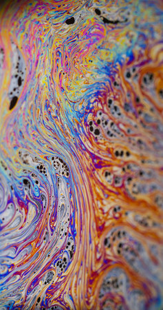 Blur art flow. Psychedelic chemical ink. Orange purple blue color mix on fuel texture. Abstract gradient bright wave on fizz background.の写真素材