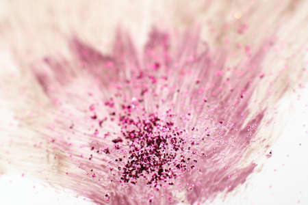 Modern art, creative abstractionism, bright color explosion. Abstract brush painting of blurred purple flower with glitter on white background.の写真素材