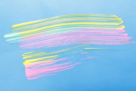 Modern creativity, abstract pop art, artwork painting. Vivid yellow and pink colors smear on blue background.の写真素材