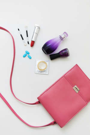 Bag Woman Accessories Condom Pills Lipstick Cosmetics Beauty Protection Conceptの写真素材
