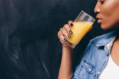 Woman Black Glass Juice Orange Drink Closeup Freespace Health Fresh Energy Background Beverage Healthy Conceptの写真素材