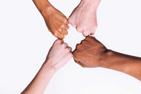 Friends Interracial Hands White Black Fist Together International Friendship United Race Equality Foreigner Education Help Conceptの写真素材