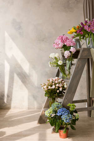 Display of flower shop with bouquets. Sale of ready-made compositions from multi-colored flowers. Mockup for advertisingの写真素材