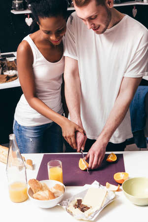 Young Couple Cook Together Culinary Home Happy Togetherness Relationship Interracial Family Healthy Food Leisure Conceptの写真素材