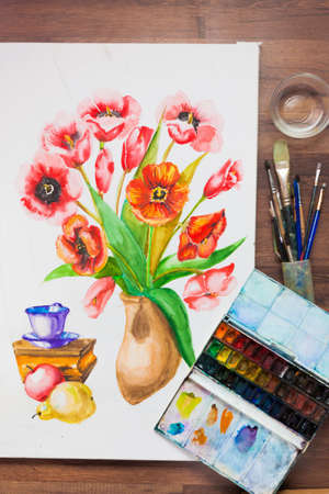 Watercolor set flat lay. Painter workplace. Creative artist, preparing to draw flowers bouquet . Drawing lessons, art school, young artist conceptの写真素材