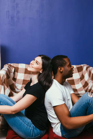 Happy Man Woman Couple Smile Home Leisure Black White Interracial Together International Relationship Rest Conceptの写真素材