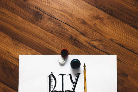 Calligraphy equipment and DIY abbreviation made with ink from above. Painter workshop, small business inspiration, creativity, calligraphy concept.の写真素材