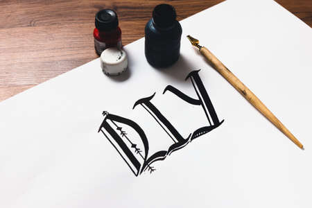 Calligraphy painter workplace. Professional equipment and DIY abbreviation made with ink top view. Artist workshop, small business inspiration, creativity concept.の写真素材