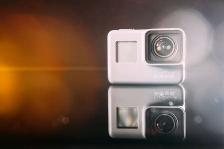Kharkov, Ukraine - April 13, 2017: GoPro HERO 5 digital action camera with lens flare closeup. Compact gadget waterproof , support 4k video, voice controls and is often used in extreme photographyのeditorial素材