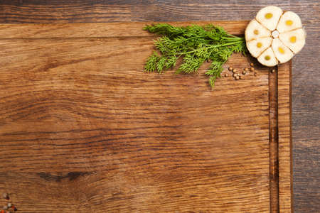 Garlic and dill with spices on cutting board preparation for cooking copy space backgroundの写真素材