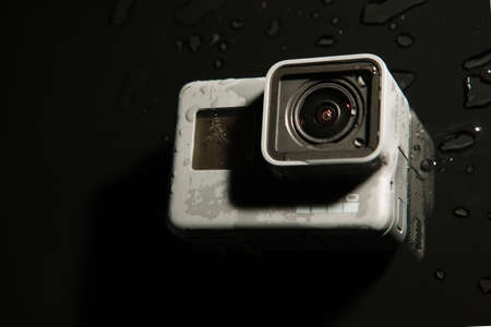 Kharkov, Ukraine - April 13, 2017: GoPro HERO 5 digital action camera with water drops top view on...