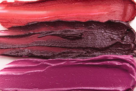 Smeared lipstick range of colorful cosmetics. Creative advertising, commercial background. Glamorous magazine, beauty conceptの写真素材