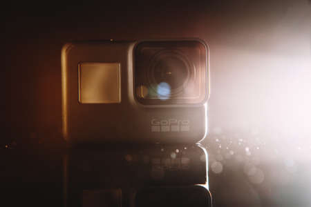 Kharkov, Ukraine - April 13, 2017: GoPro HERO 5 digital action camera in spotlight with lensflare on black. Compact gadget waterproof , support 4k video and is often used in extreme photographyのeditorial素材