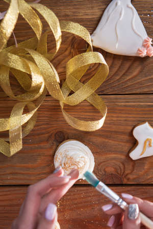 Cupcake decorated with powder, baking present. Colorful food, homemade cookies, small business. Decorating beautiful colors, cooking conceptの写真素材