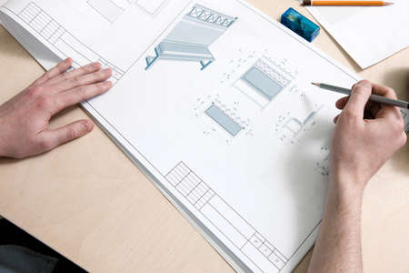 Designers drawing scheme piece of furniture on creative desk. Top veiw of working process
