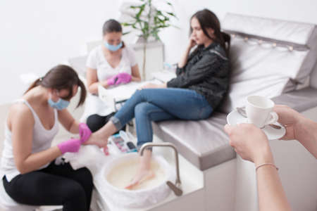 Conjunction gel polish manicure and pedicure. Professional body care for beauty and health in salon.の写真素材