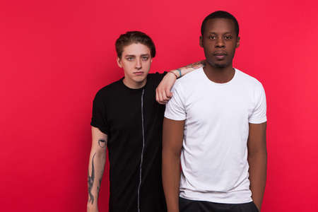 Interracial friendship. Good friends together. Interesting leisure time, european and african american male, fellowship conceptの写真素材