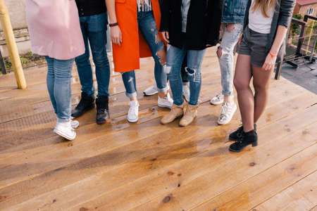 Women company. Fashion style background, unrecognizable females. Girls party, friendship conceptの写真素材