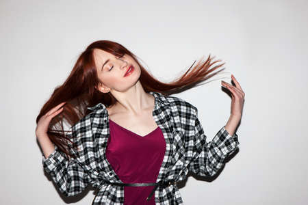 Light and happy girl. Confident lady. Stylish fashion model, freedom for young woman, seduction conceptの写真素材