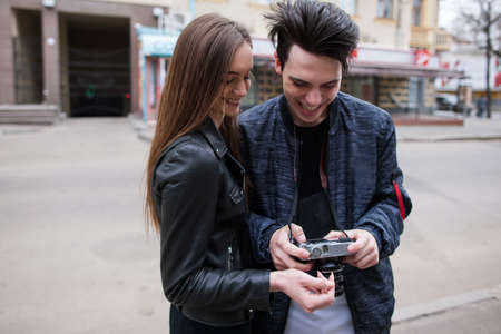 Street photo shoot. Photographers enjoy process. Creative stylish youth lifestyle. Modern young people outdoorsの写真素材