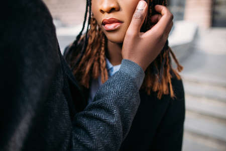 Tender love relationship. Soft touch. Unrecognizable black couple in selective focus, man loves woman, kindness conceptの写真素材