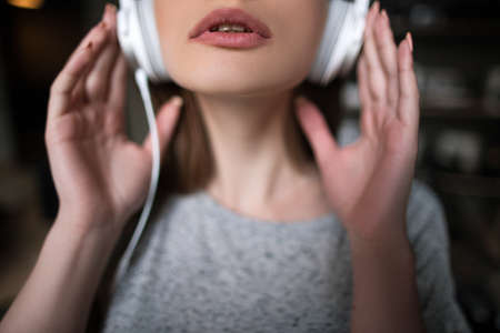 Seductive young female. Pleasure background. Sexual mood, unrecognizable woman enjoying music in...