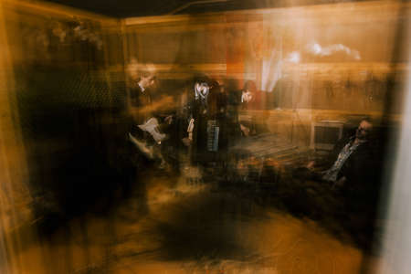 Music recording studio in garage background. Band rehearsal before concert, unrecognizable...