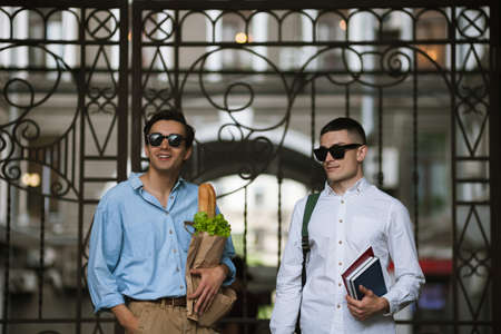 Modern students life. Stylish young men. Two confident males outdoors, hipsters healthy lifestyleの写真素材