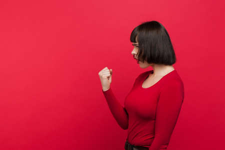 Angry female. Sorting out relationship. Woman threatening someone, unrecognizable girl, interdiction conceptの写真素材