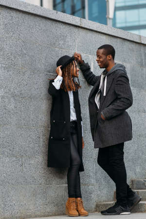 Fun leisure time. Black happy young couple. Active African American people first date, fashion street style, happiness conceptの写真素材
