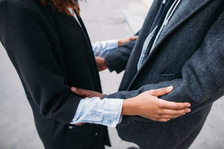 Atmospheric strong relations. Love cuddles. Unrecognizable black people, gentle touch, romance conceptの写真素材