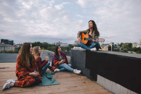 Beginning singer and fans. Acoustic concert, musical career, big dreams, free people, music show, resting youth conceptの写真素材