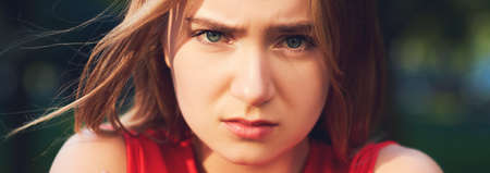 Loneliness. Offended and sad girl. Lack of communication, quarrel, break of relations, divorce, need help, cold weather conceptの写真素材