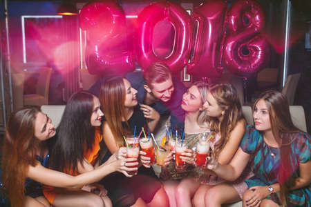 New Year 2018 celebration. Happy company. Christmas corporate party, friends in night club with...