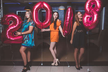 New Year party. Pretty model girls. Merry Christmas 2018 in night club, festive mood background....